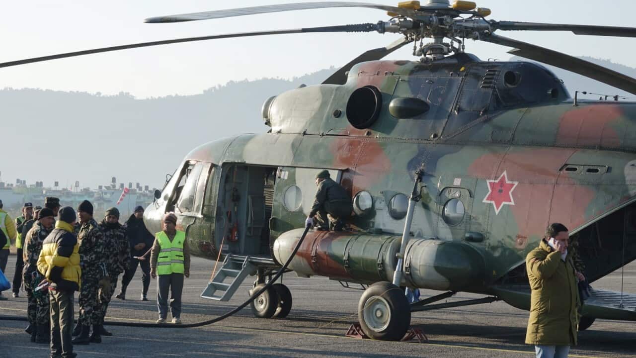 A Nepali Army chopper prepares to take off at Pokhara Airport