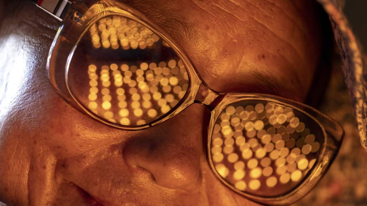 A Nepali Buddhist devotee lights butter lamps on the occasion of Buddha Jayanti at Syambhu temple in Kathmandu, Nepal, 05 May 2023.