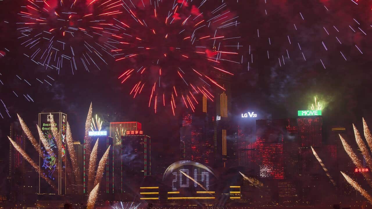 Fireworks illuminate the night sky over Hong Kong's Victoria Harbour during New Year's Eve celebrations
