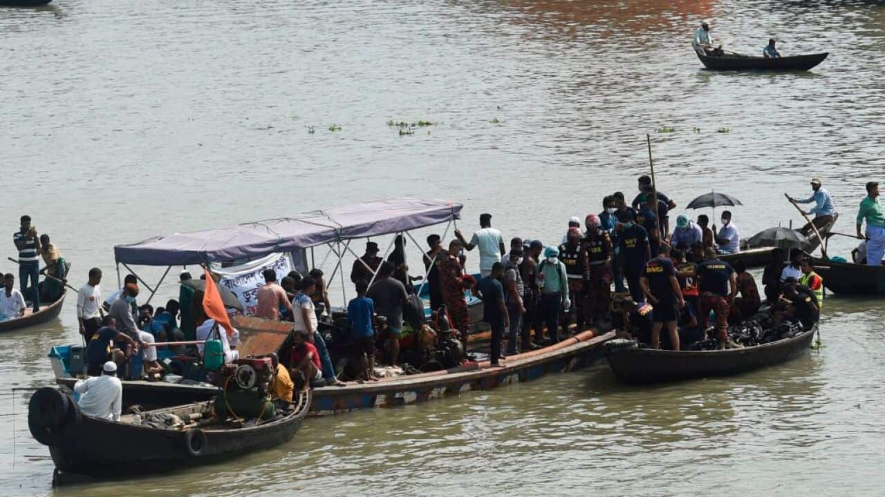 Rescue workers search for victims after a ferry capsized at the Sadarghat ferry terminal in Dhaka, Bangladesh.
