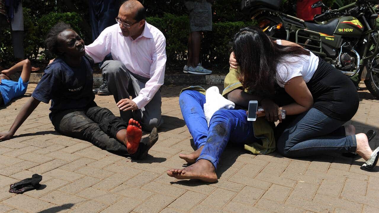 People injured in the Nairobi attack receive help from passers-by - AAP.jpg