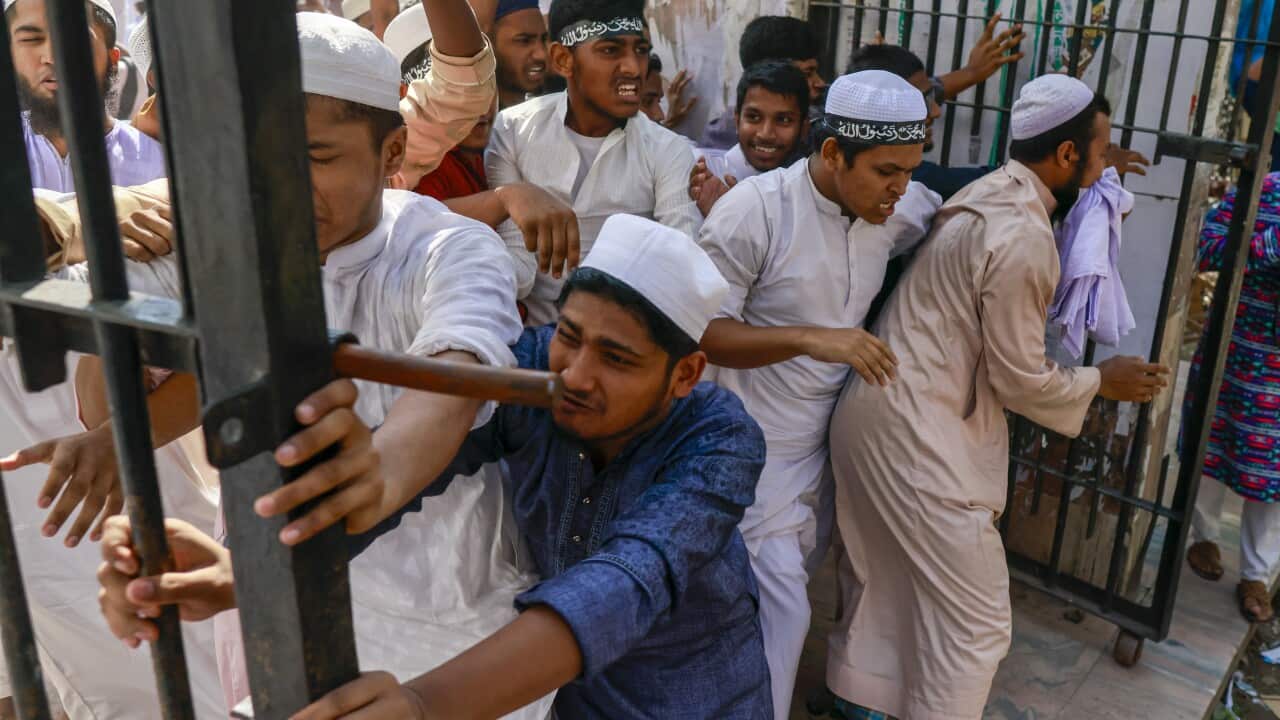 Bangladeshi Islamist actives clash with policemen at the Baitul Mukarram Mosque area in Dhaka, Bangladesh, 15 October 2021.