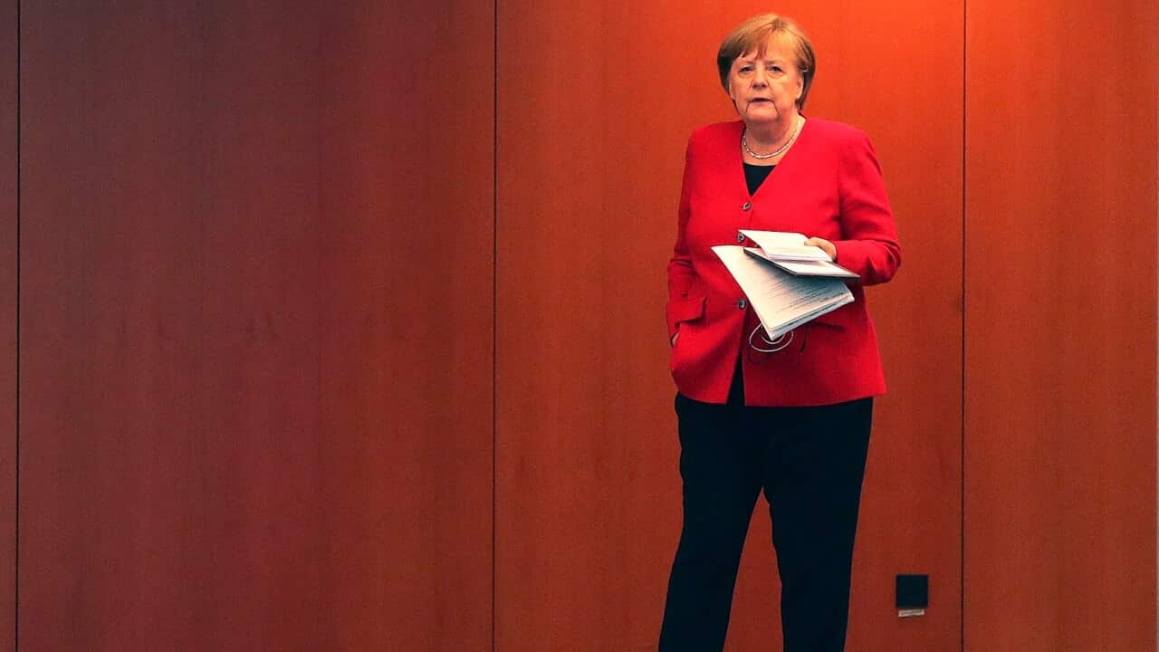 German Chancellor Angela Merkel waits for the beginning of a press conference in Berlin