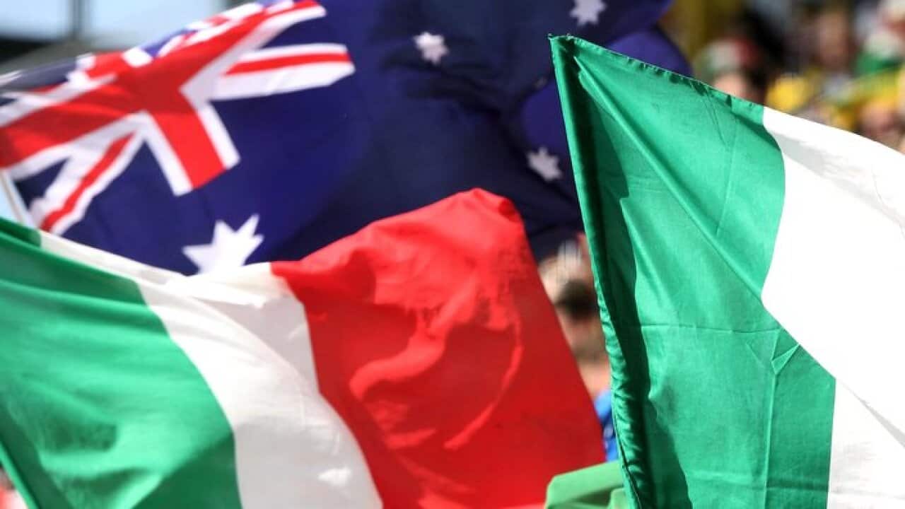Fans wave Italian and Australian (top L)