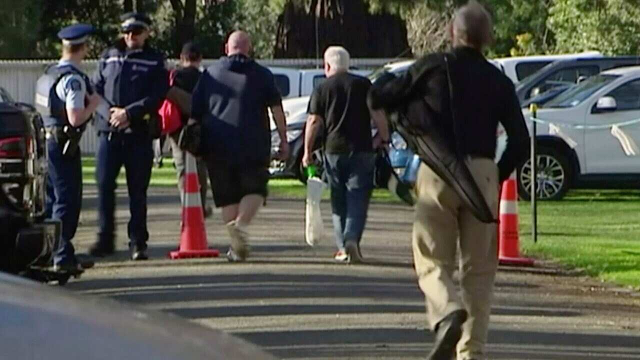 People bring their guns to exchange for money in Christchurch, New Zealand.