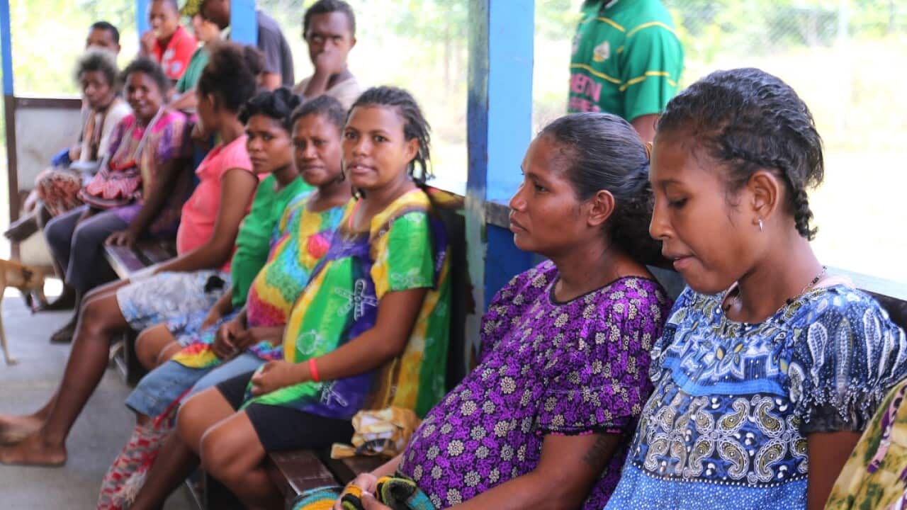 Pregnant women wait at a health clinic in PNG.