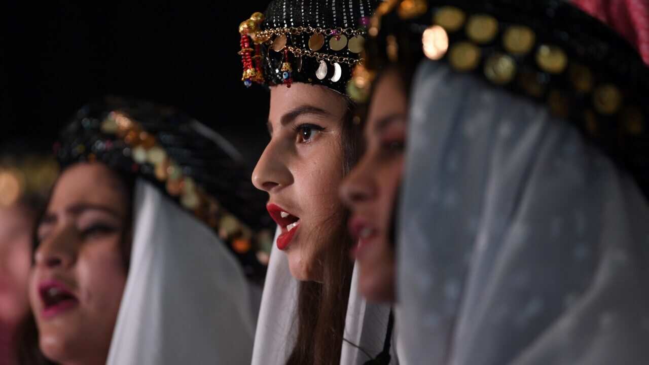 A group of young Yazidi refugees perform a traditional dance (AAP)
