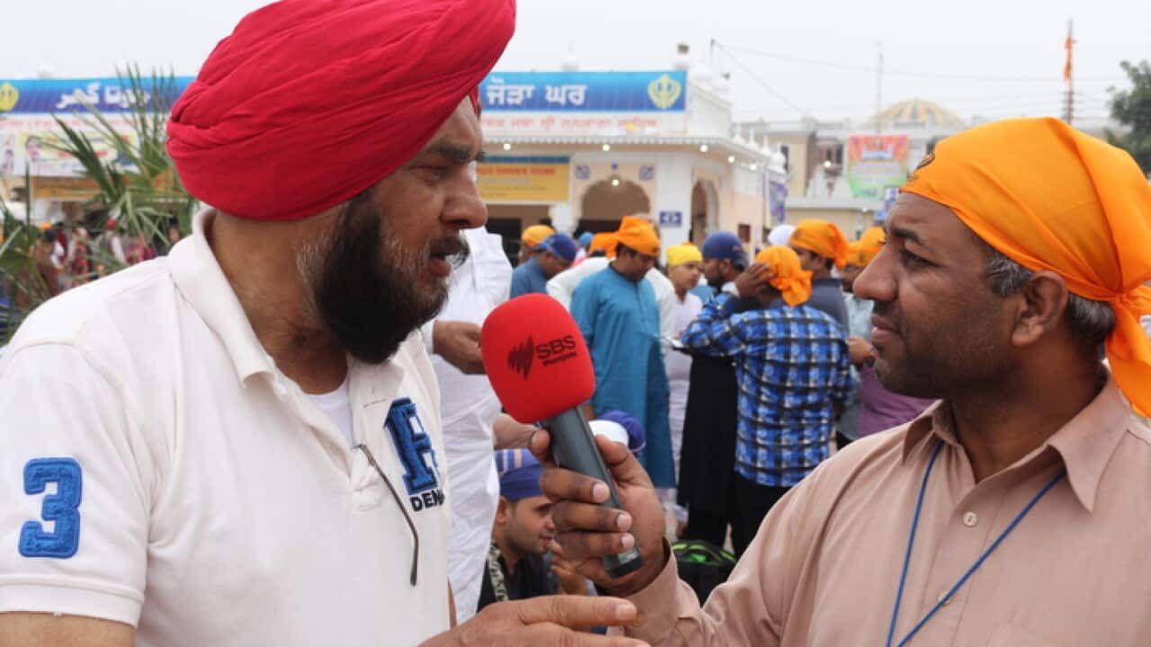 A visitor from India speaking to SBS Punjabi's Masood Mallhi at Nankana Sahib, Pakistan