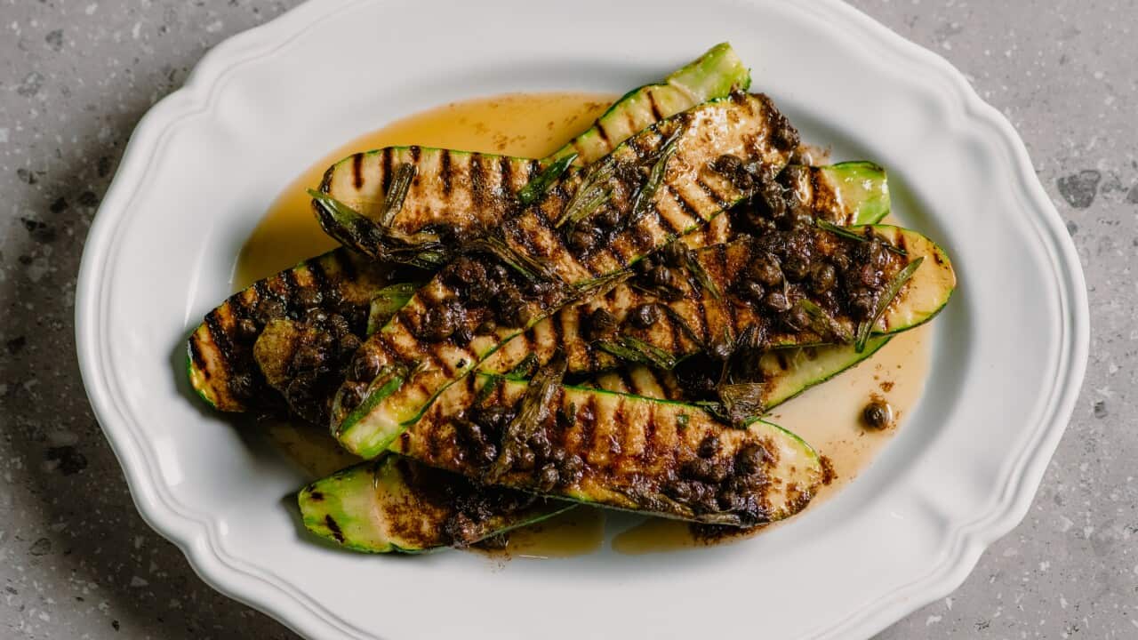 Charred zucchini with tarragon, anchovy and capers