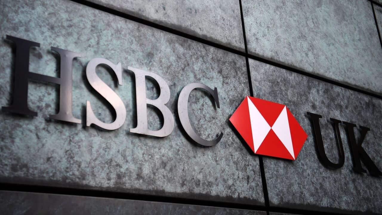 A HSBC logo is pictured on a wall outside a branch of the bank in central London.
