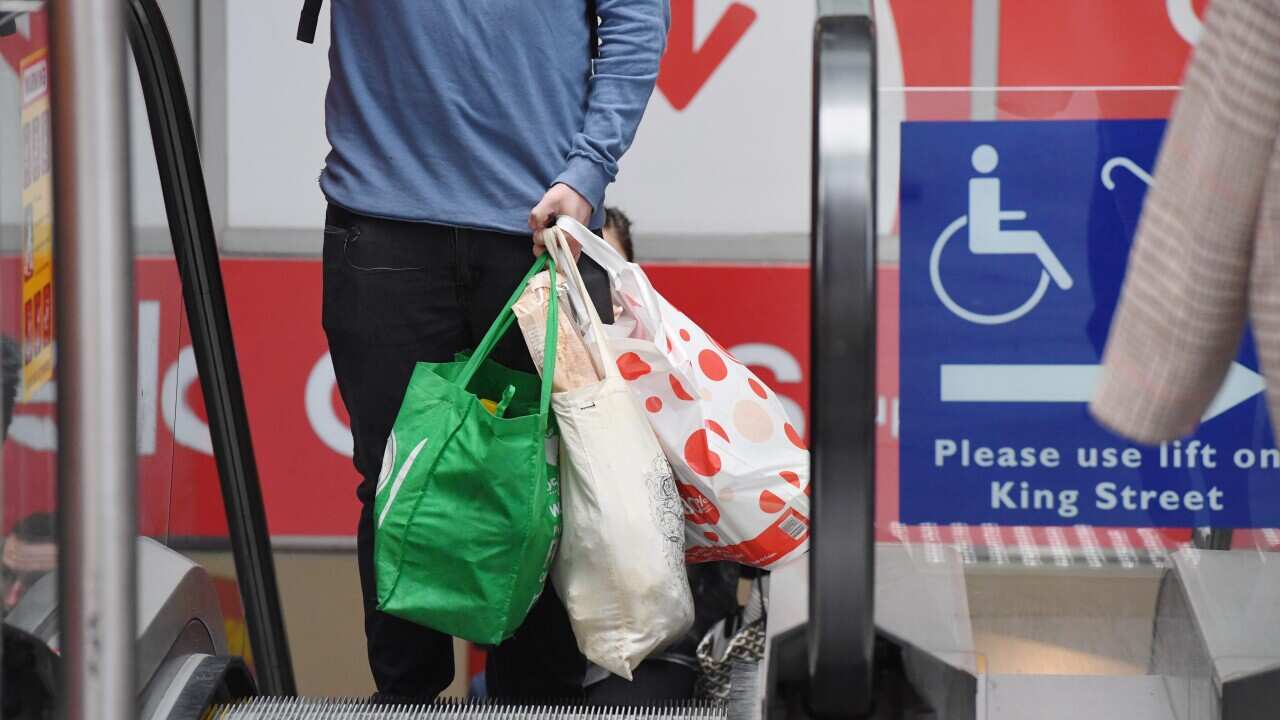 A shopper is seen carrying bags at a Coles Sydney CBD store, Sydney, Monday, July 2, 2018.