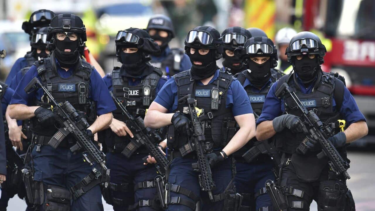 Armed police on St Thomas Street, London, Sunday June 4, 2017, near the scene of Saturday night's terrorist incident on London Bridge and at Borough Market.
