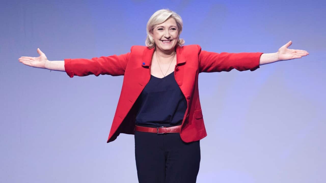 Far-right candidate for the presidential election Marine Le Pen gestures as she arrives for a campaign meeting in Paris, France, Monday, April 17, 2017.