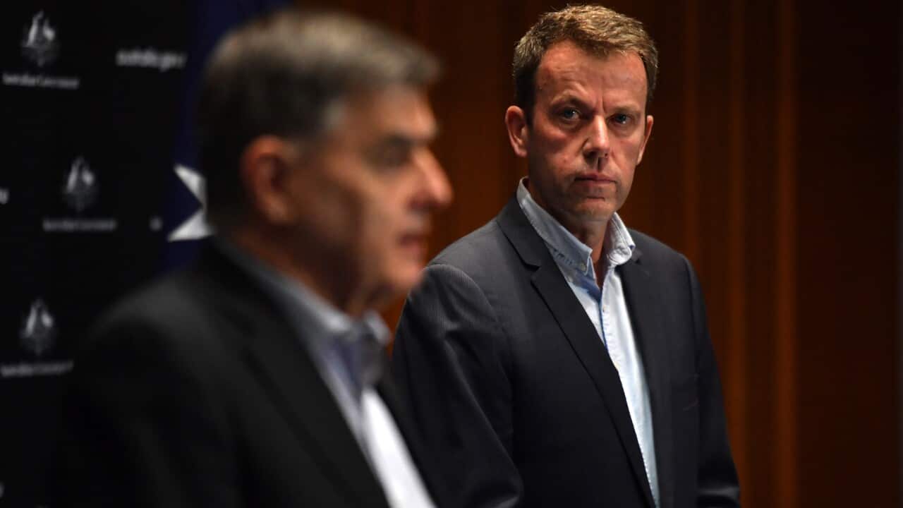 Chief Medical Officer Professor Brendan Murphy and Minister for Education Dan Tehan speak to the media at a press conference at Parliament House in Canberra, Sunday, April 12, 2020. (AAP Image/Mick Tsikas) NO ARCHIVING