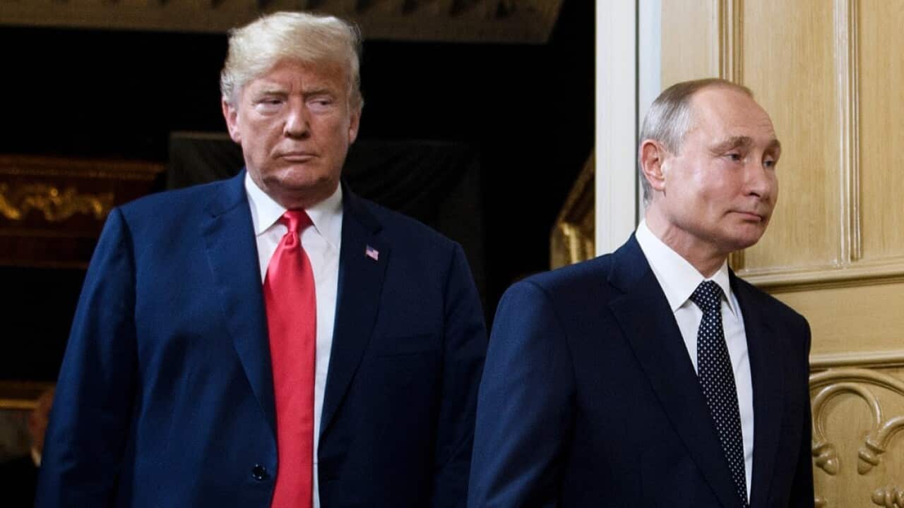 US President Donald Trump (L) and Russian President Vladimir Putin arrive for a meeting in Helsinki, on July 16, 2018. 