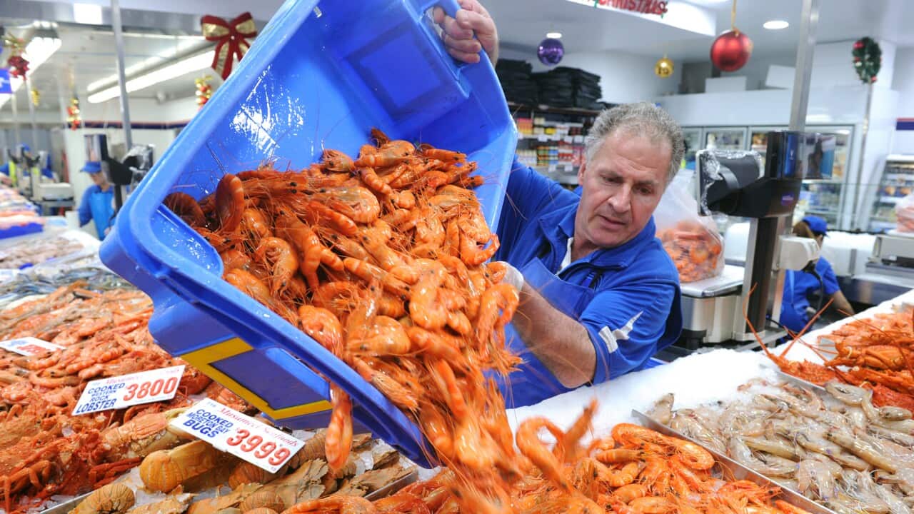 Workers restock prawns at the Sydney Fish Market, in Sydney, Friday, Dec. 23, 2016. The Sydney Fish Markets trade for a marathon 36 hours from 5 am today, in what is the markets' busiest period of trade. (AAP Image/Joel Carrett) NO ARCHIVING
