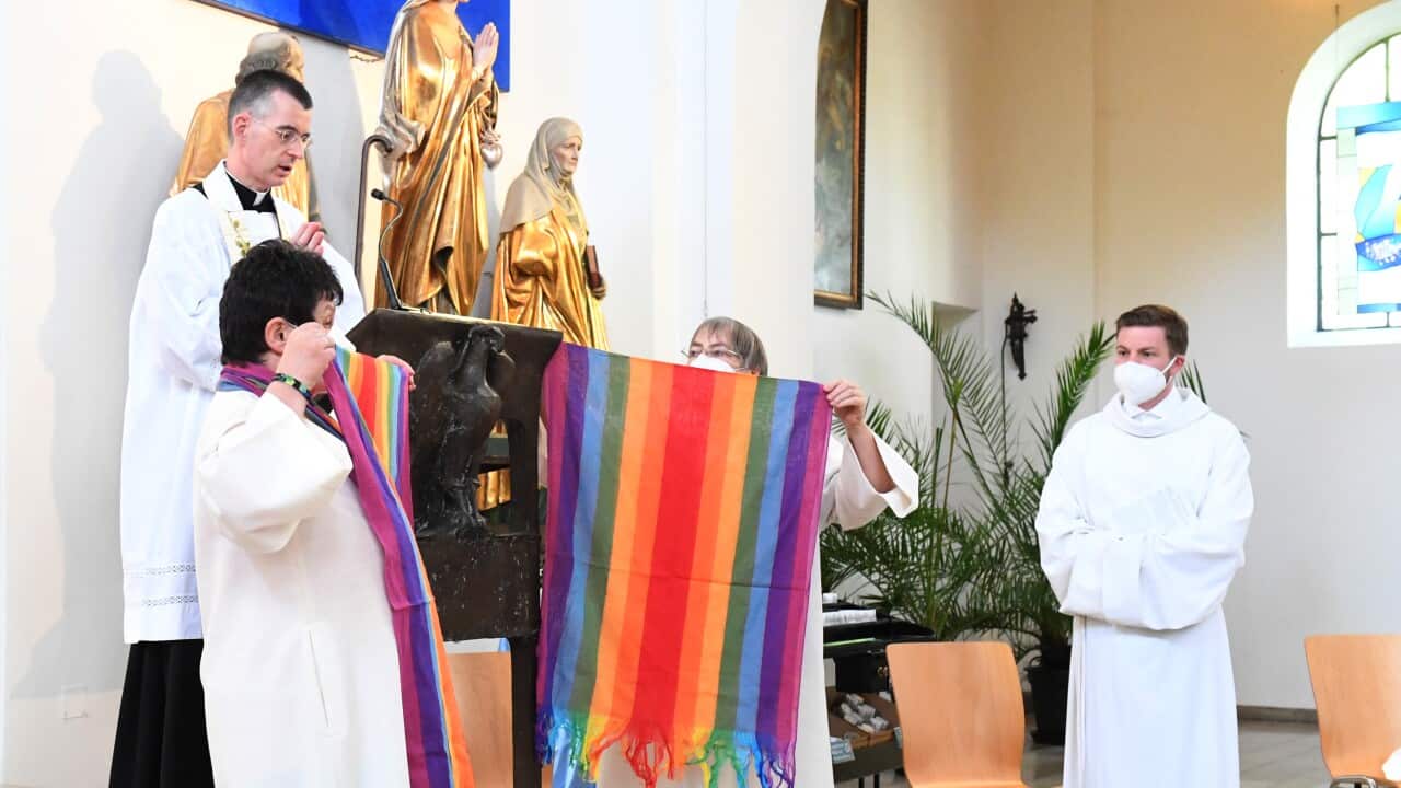 Rainbow flags are raised in St. Benedict Church in Munich during a Catholic service with the blessing of homosexual couples as part of a nationwide campaign.
