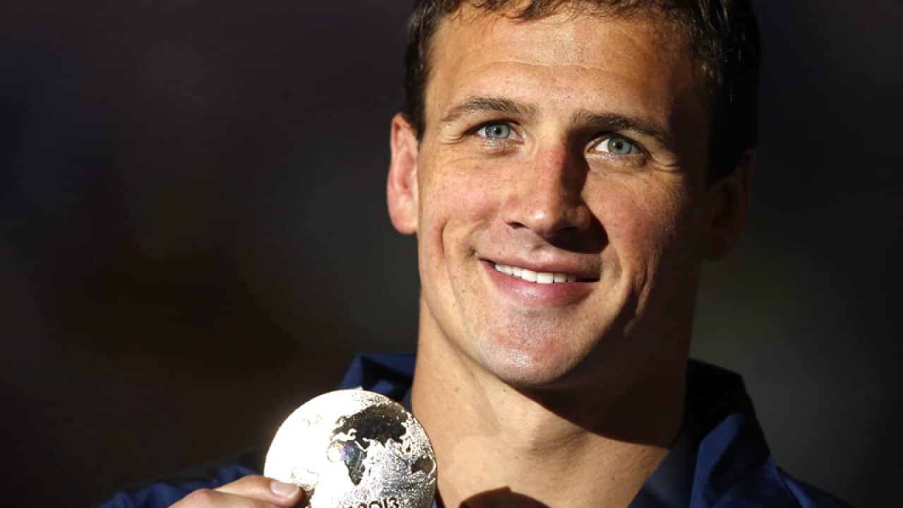 Busy Lochte claims golden double