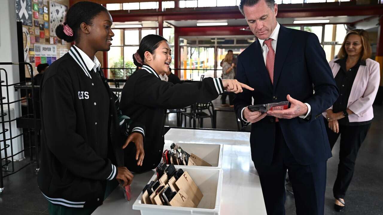 NSW Premier Chris Minns confirmed the mobile phone ban will be implemented later this year during a visits to Condell Park High School on 3 April 2023.