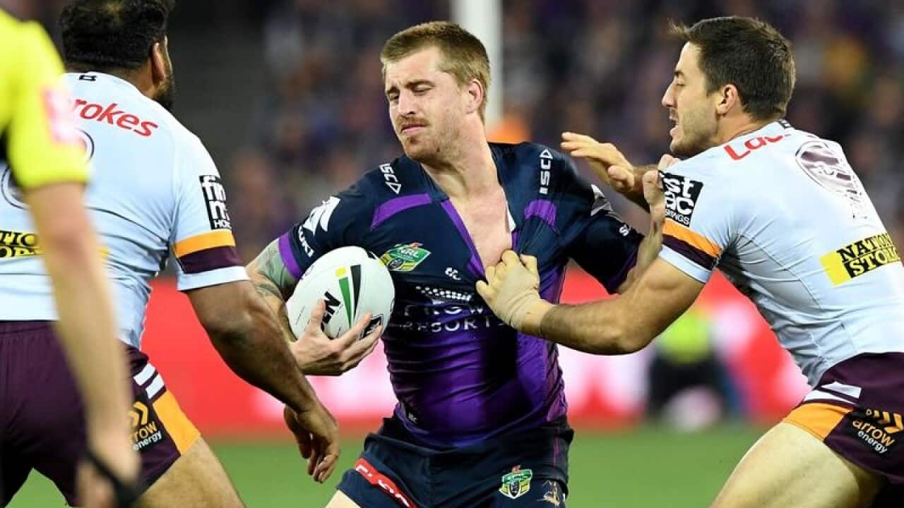 Cameron Munster of the Storm is tackled