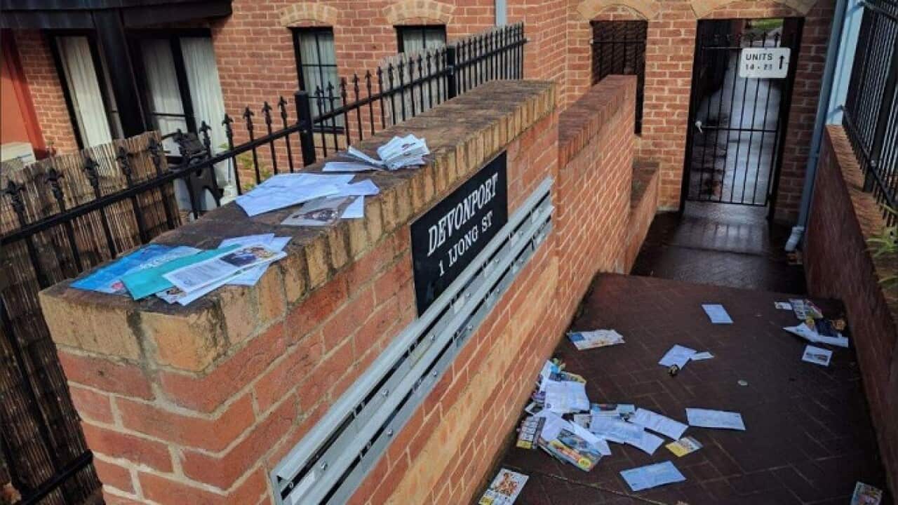 Same-sex marriage surveys strewn about the street after rain