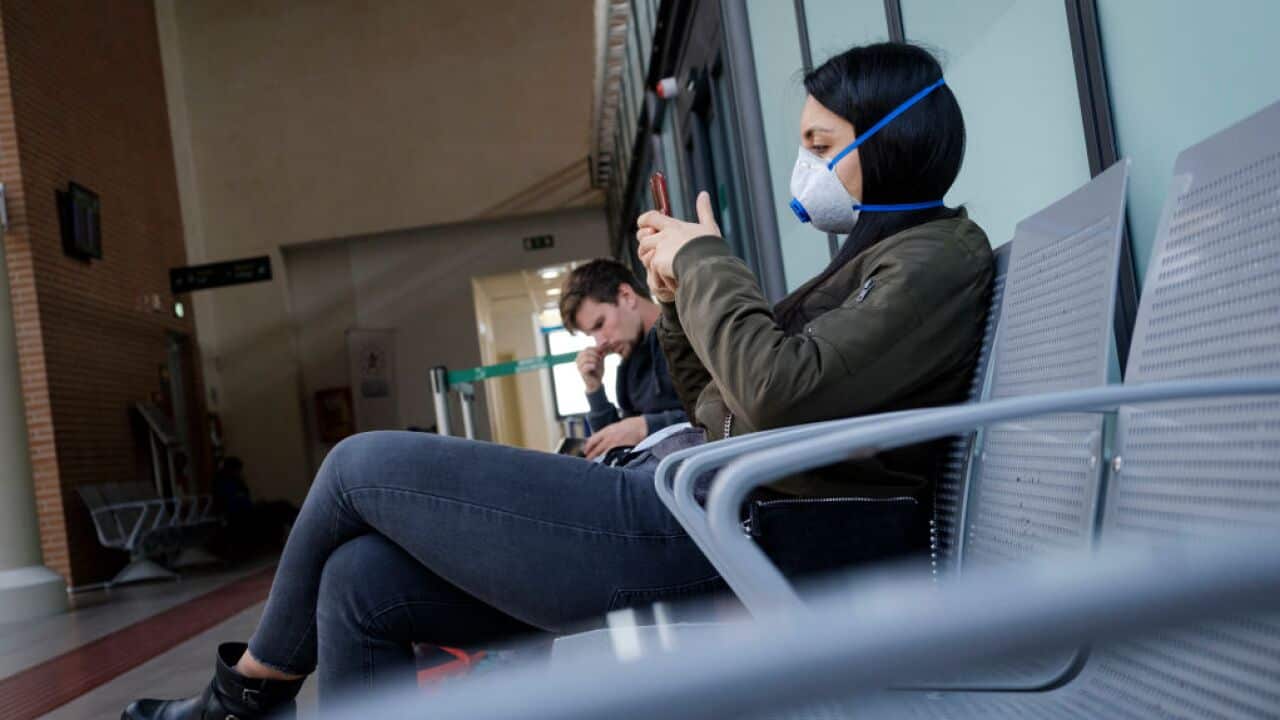 Travelers Wear Surgical Masks At Treviso Airport