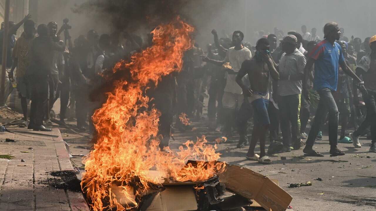Protesters march against the escalating conflict in eastern DRC in Kinshasa