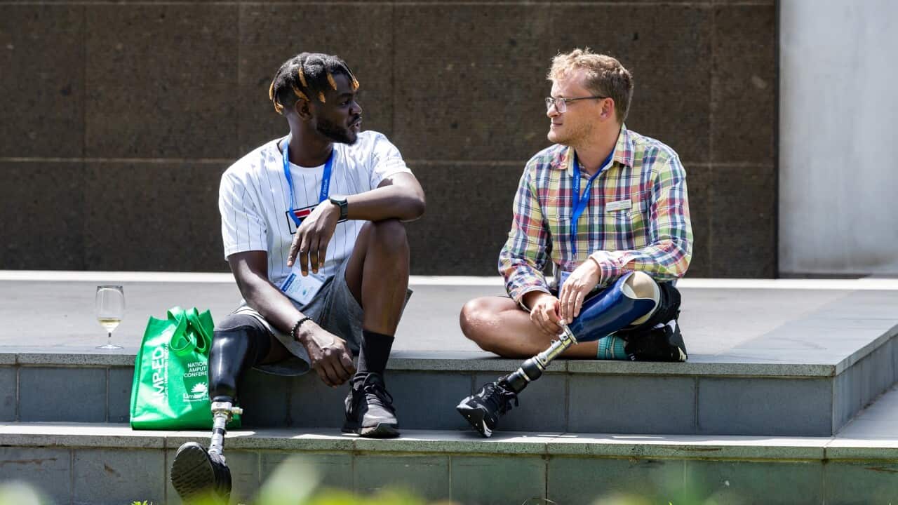 Two amputees chatting (Supplied).jpg