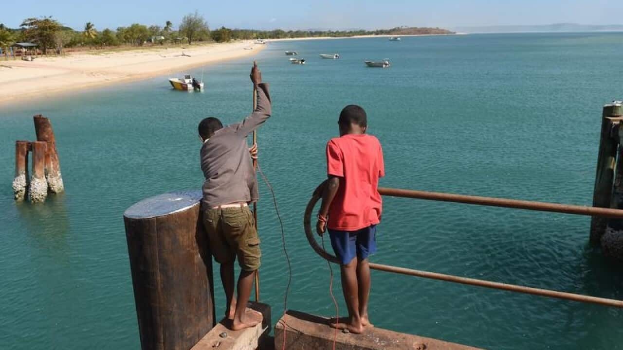 A file photo of boys fishing on the ferry dock, in the Northern Peninsula Area, Torres Strait.