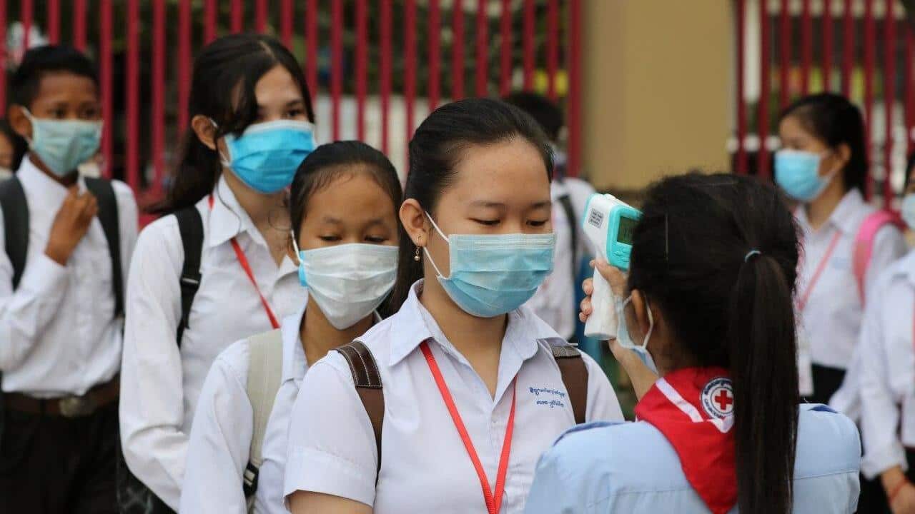 Temperature checked at school in Cambodia during Covid outbreak