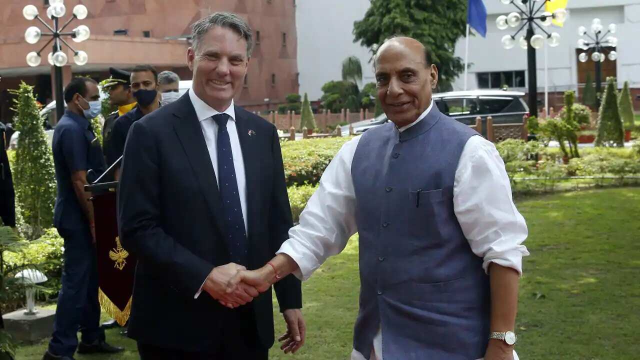 Defence Minister Rajnath Singh (left) welcomes Richard Marles during the joint military guard of honour at Vigyan Bhawan in New Delhi, India.