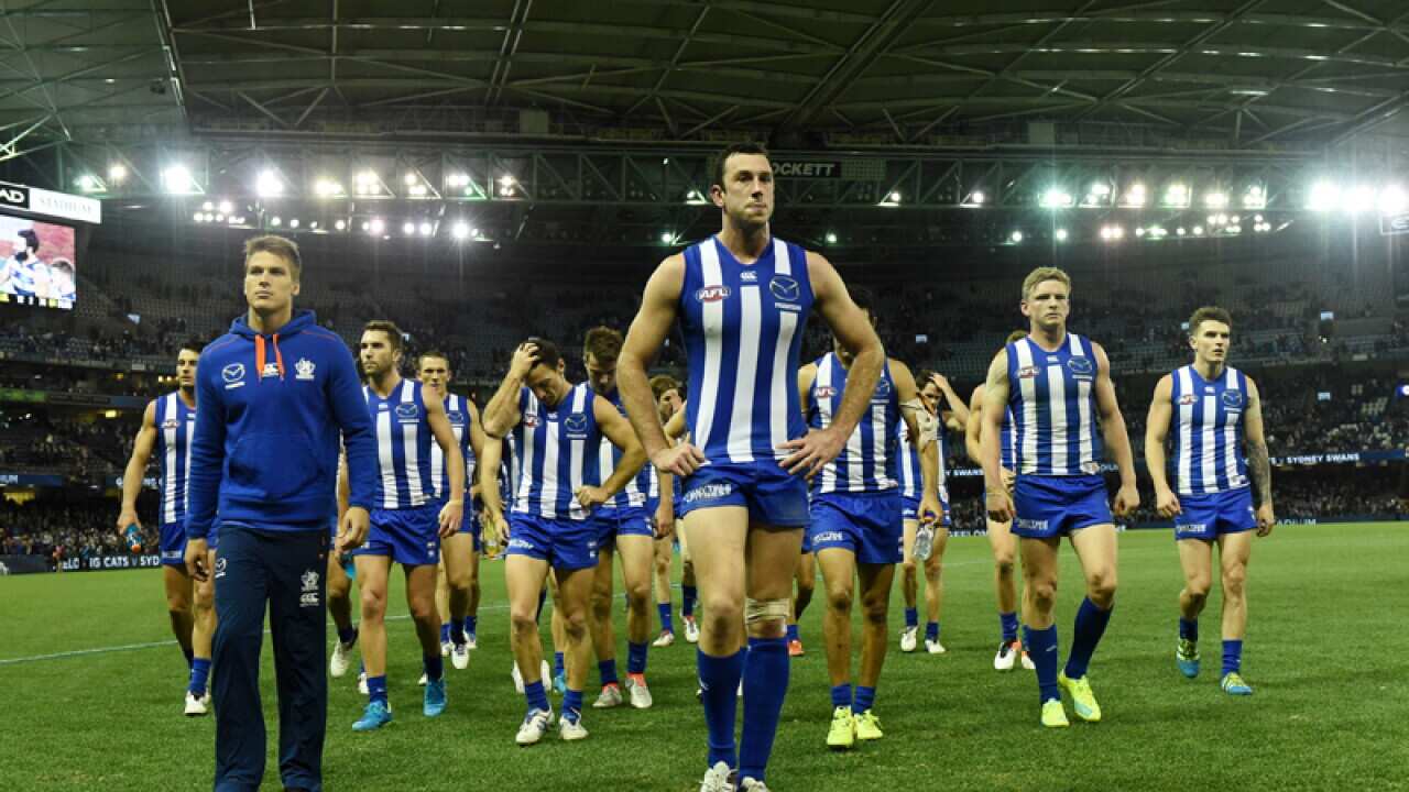 The Kangaroos walk off the field