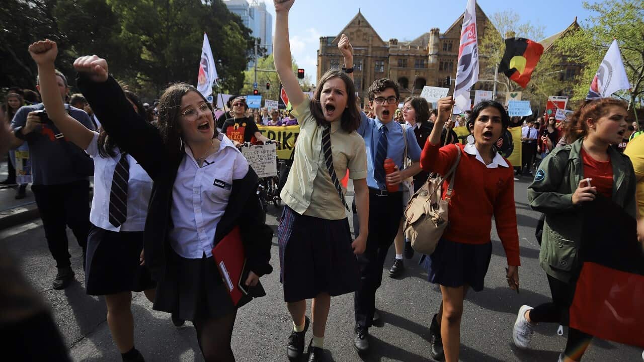 Protesters participate in The Global Strike 4 Climate rally in Sydney.