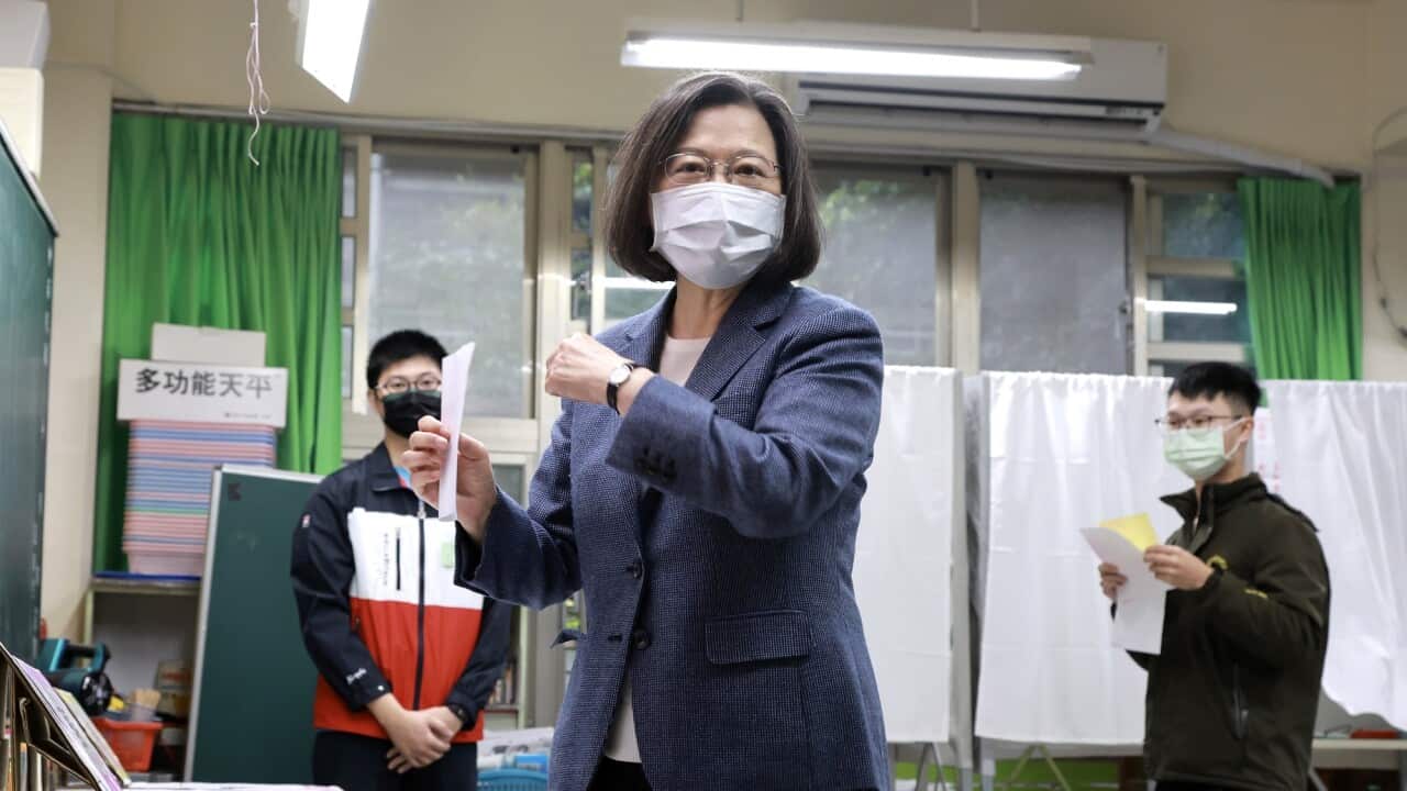 Taiwan President Tsai Ing-wen casts her vote in local elections at a polling station in Taipei on 26 November 2022.