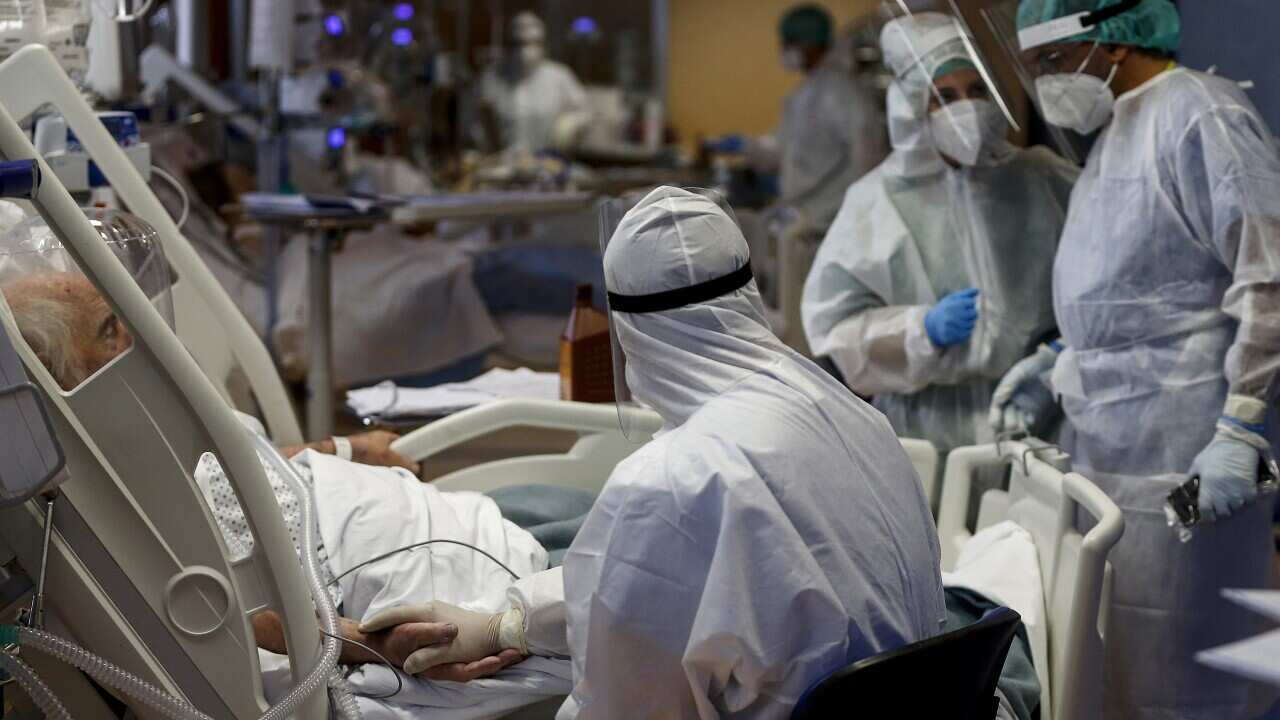 Health workers attend to a COVID-19 patient at one of the intensive care units in Italy.