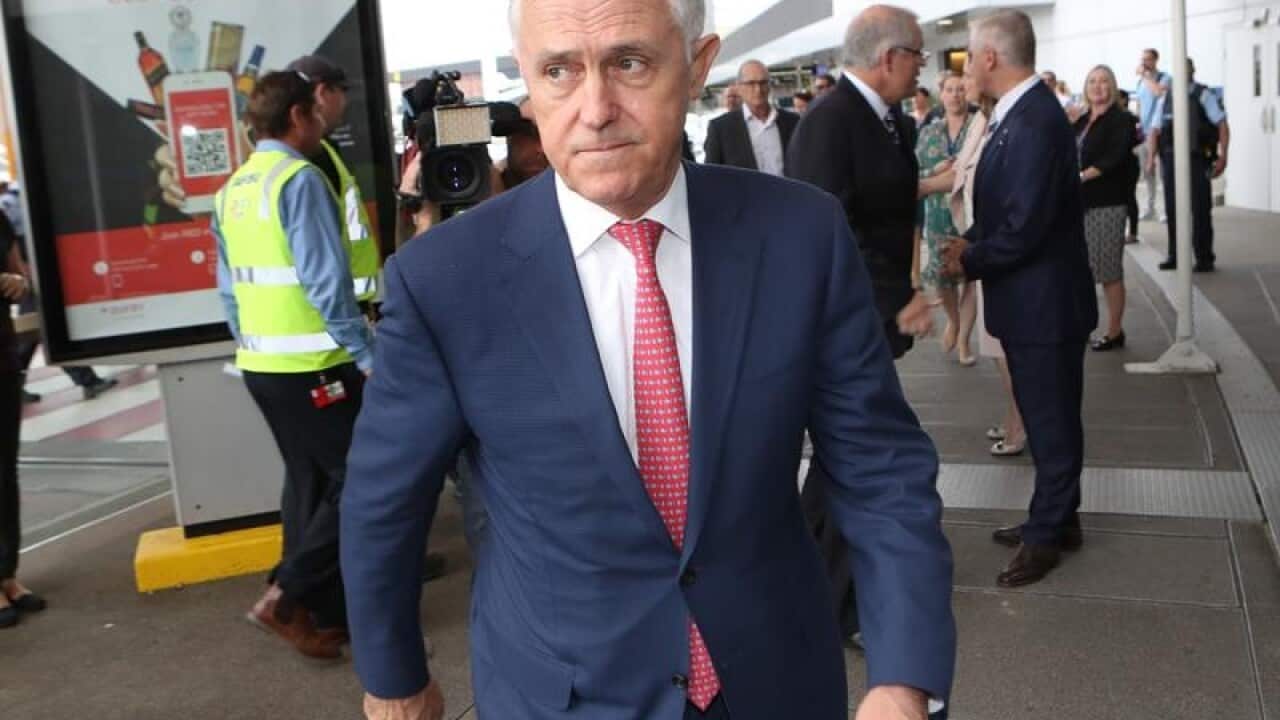 PM Malcolm Turnbull leaves a press conference in Melbourne.