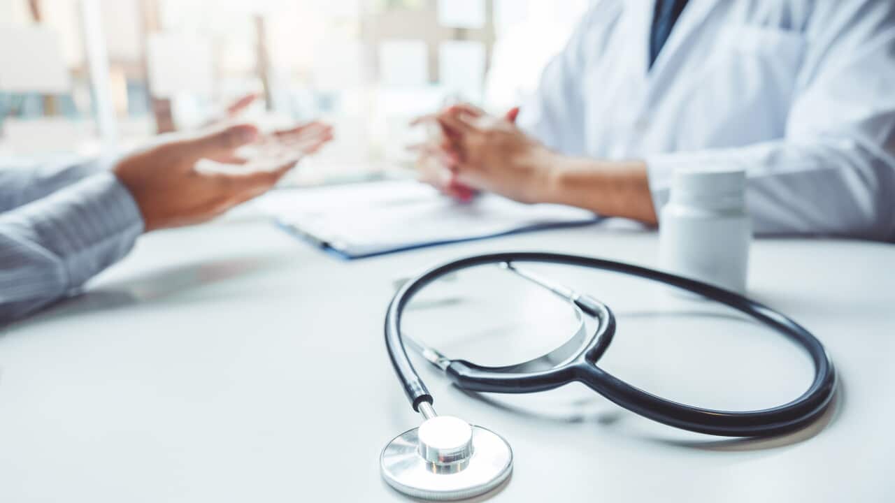 Doctors and patients consulting and diagnostic examining sit and talk. At the table near the window in the hospital medicine concept