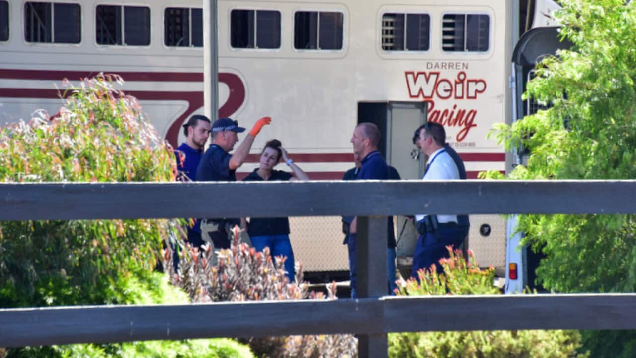 Police are seen at Darren Weir Stables in Miners Rest, Victoria