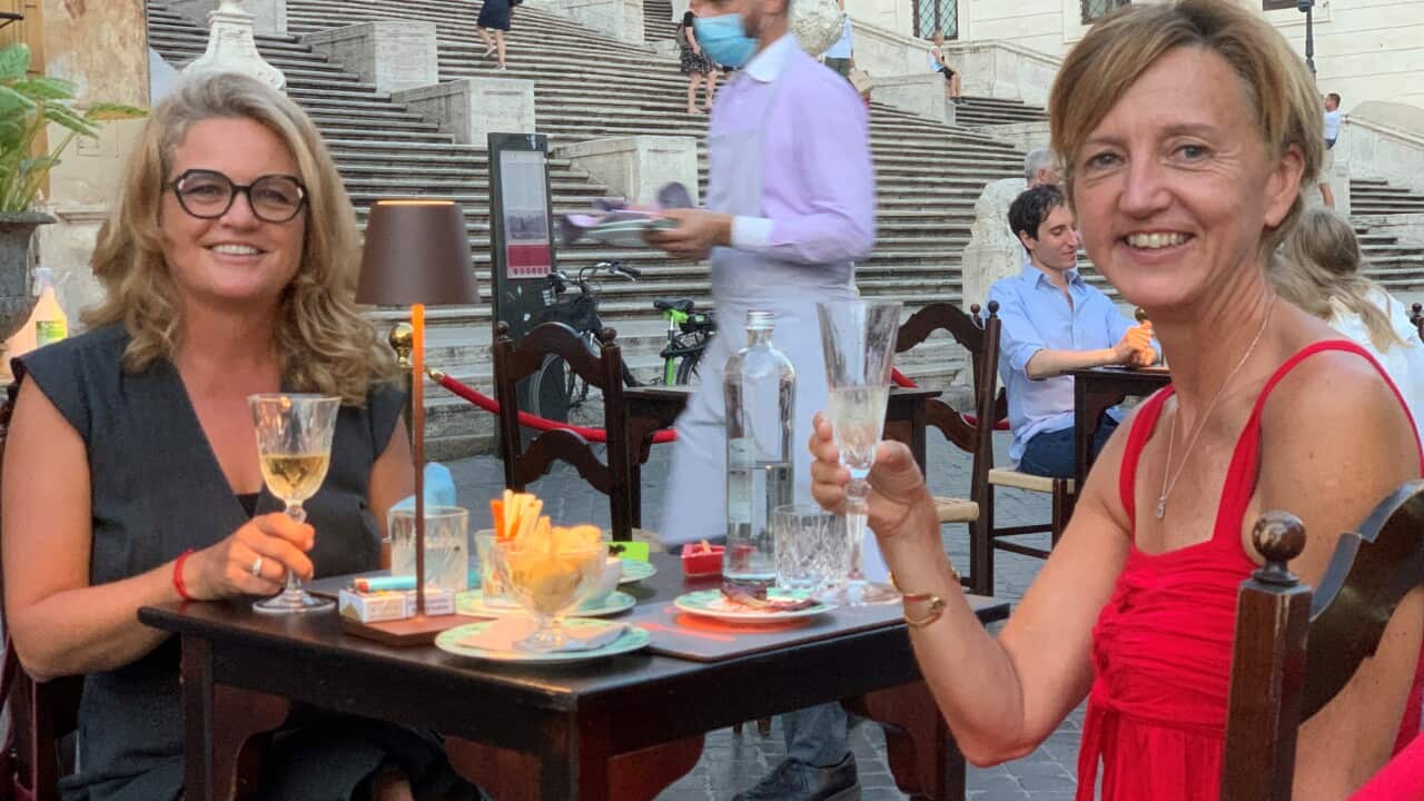 Kathryn Fink sitting with a friend in Rome
