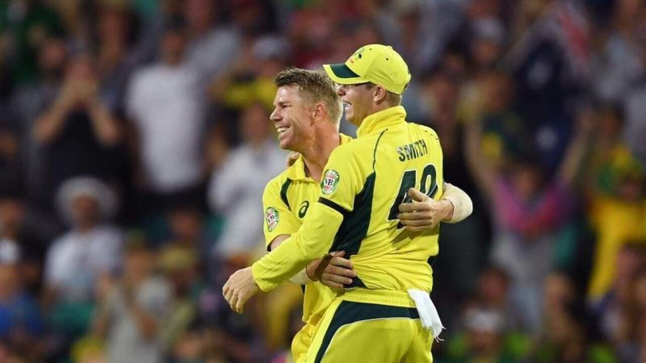 David Warner (left) of Australia is congratulated by Steve Smith