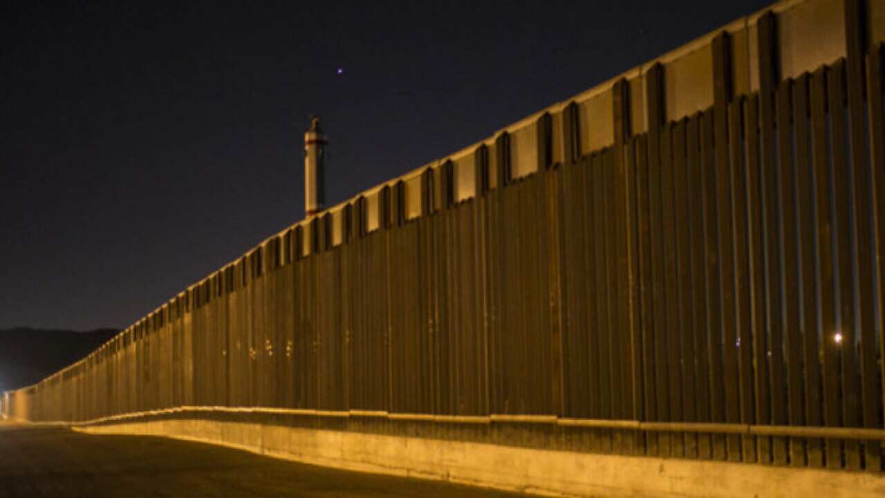 A portion of fence that stretches along the US-Mexico border