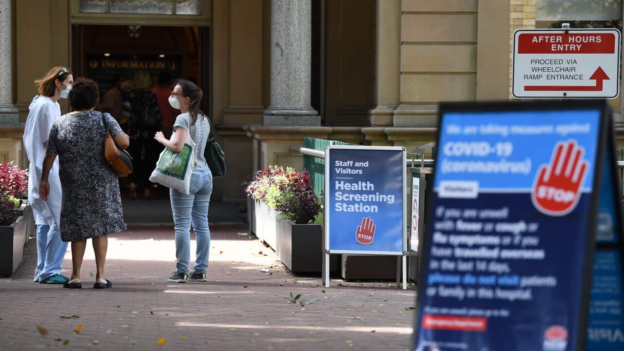 Staff wearing face masks outside the Royal Prince Alfred Hospitalin Camperdown, Sydney.