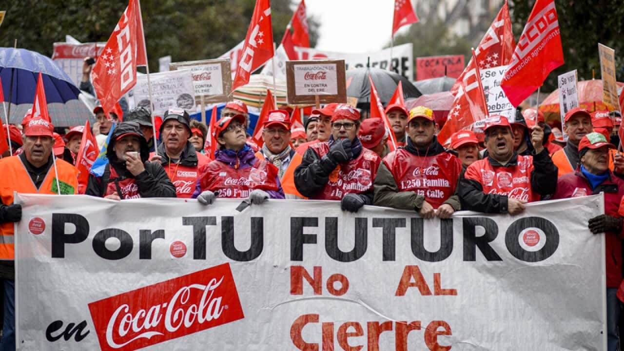 Thousands of workers march against the closure of bottling plants