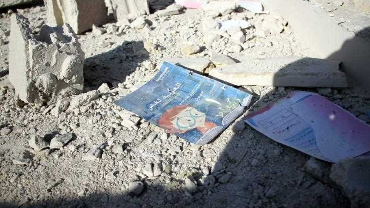 An Arabic language book lay on the ground at a school that was bombed a day earlier in rebel-held Idlib, northern Syria
