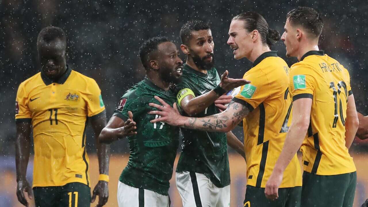 Socceroo Jackson Irvine exchanges words with some Saudi Arabia players during their FIFA World Cup qualifier