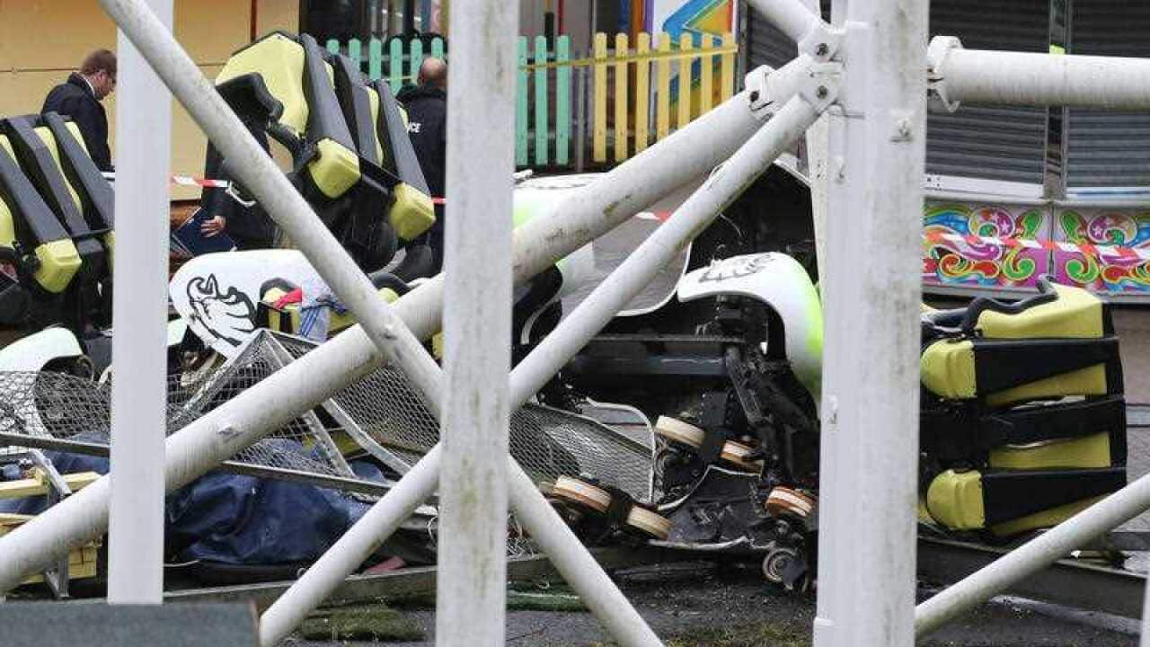 Part of the amusement ride lays in wreckage as investigations get underway following a rollercoaster derailment at the M&D's amusement park in Scotland
