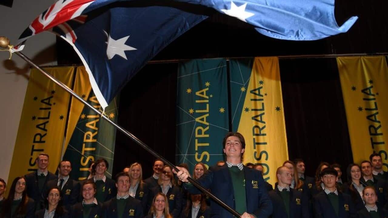 Australian halfpipe snowboarder Scotty James waves the Australian flag