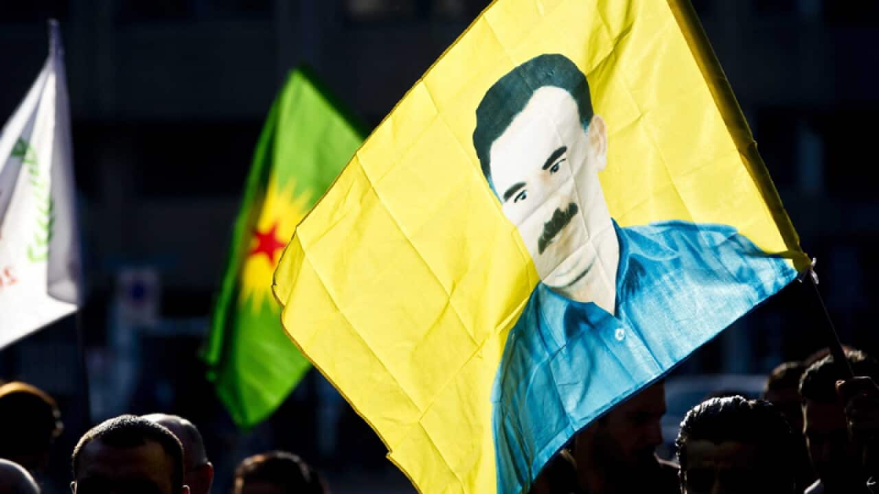 Kurdish protestors with the portrait of jailed leader Abdullah Ocalan