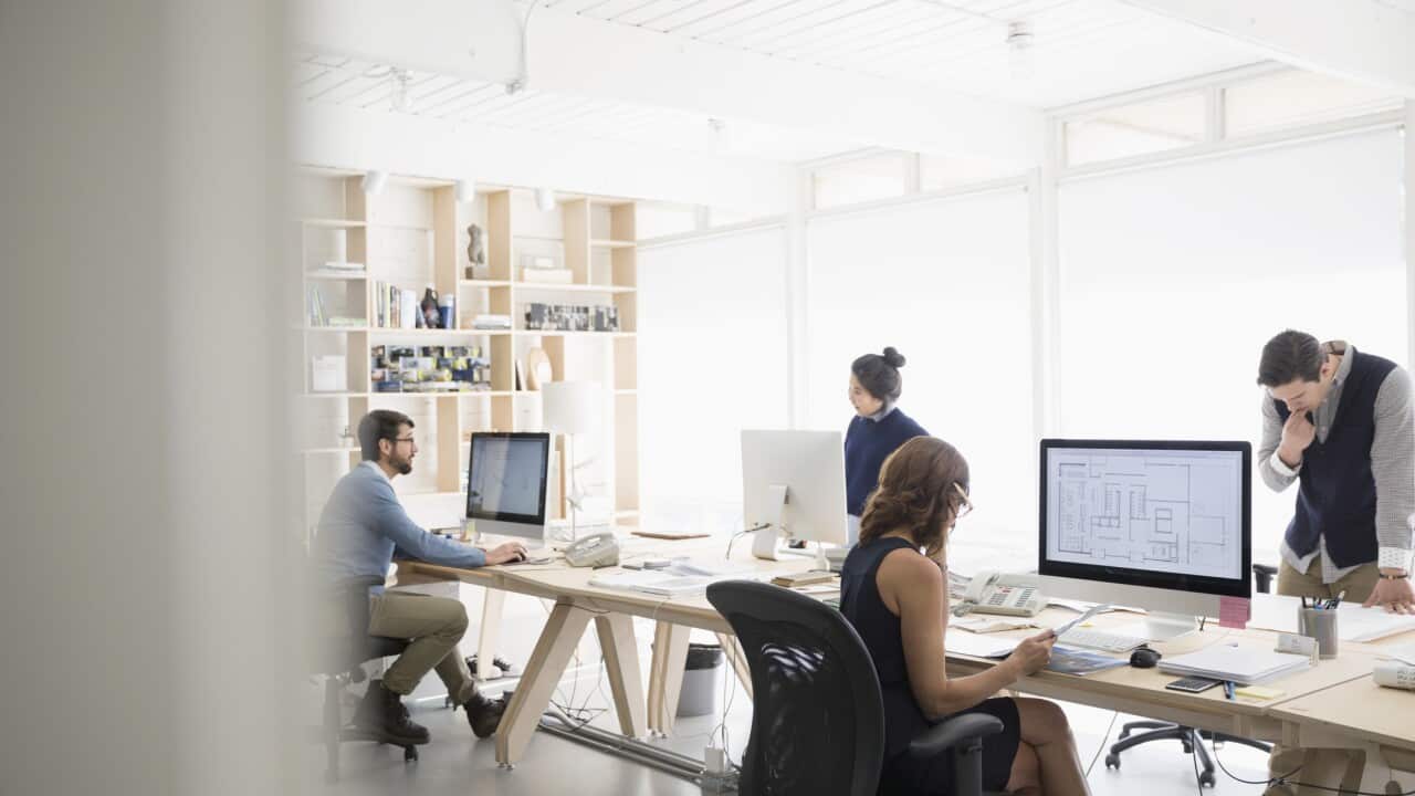Workers in an open plan office