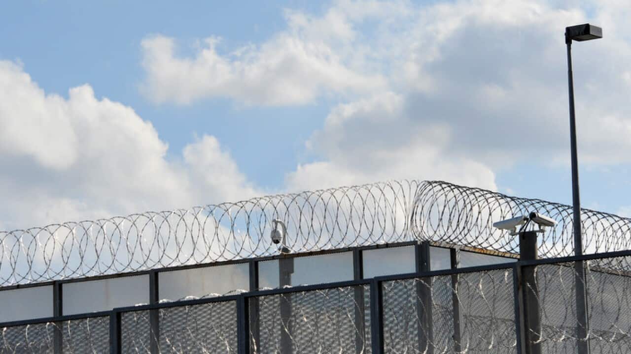 The perimeter fence at Silverwater jail in Sydney's west, Monday, April 1, 2013. Two prisoners have been found dead in a cell at Silverwater jail during an inspection early today. (AAP Image/Paul Miller) NO ARCHIVING